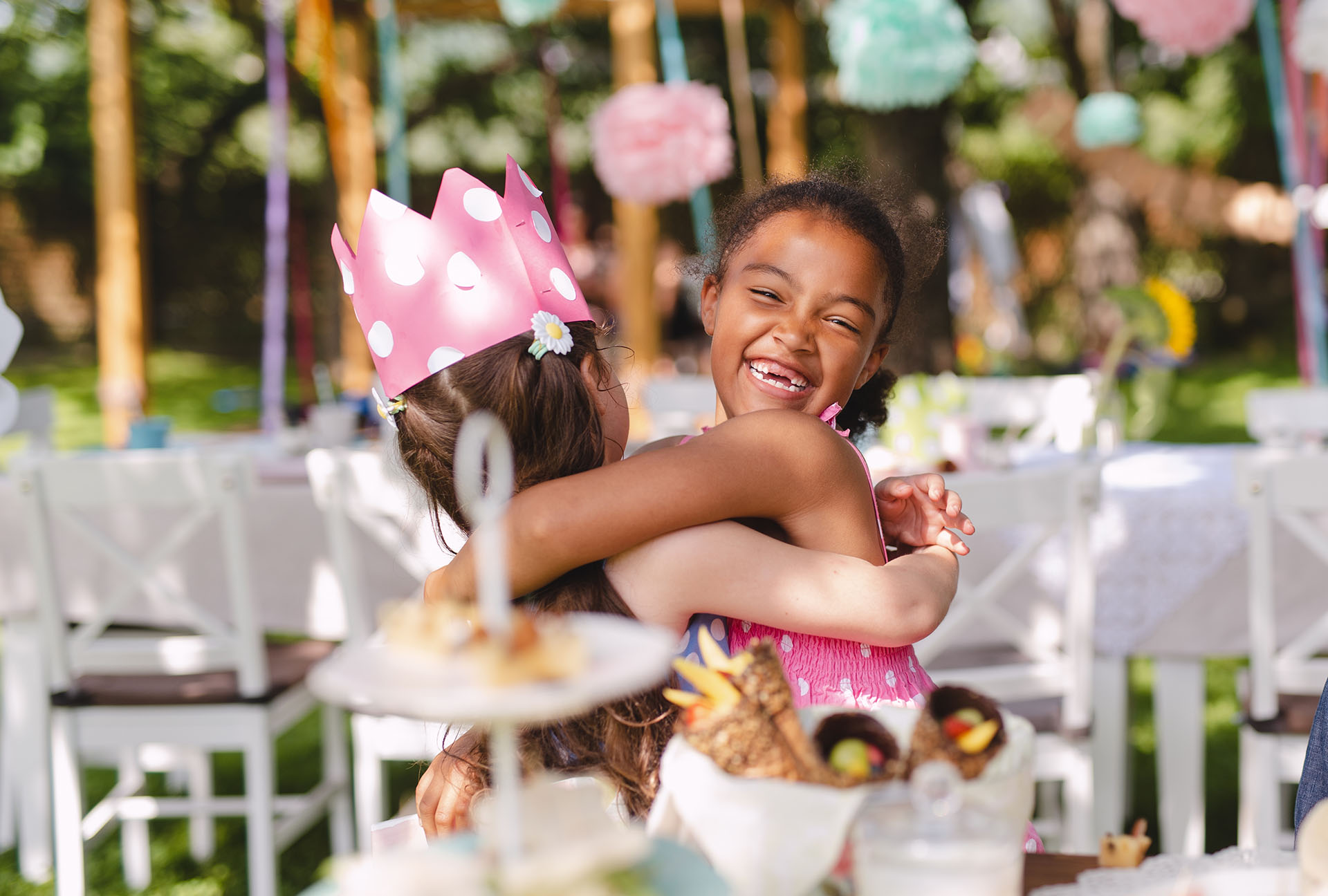 Sun Celebrations Young Girls Hugging Outdoor Party