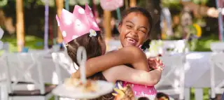 Sun Celebrations Young Girls Hugging Outdoor Party