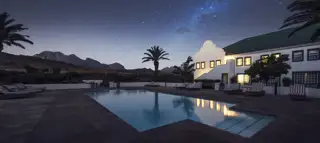Gold Pool Night Hotel Mountain Sky View 1