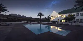Gold Pool Night Hotel Mountain Sky View 1