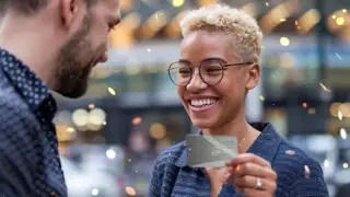 Woman Holding Silver Mvg Card