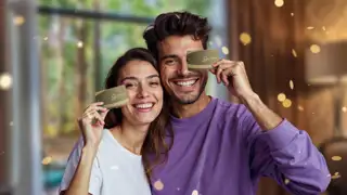Couple Holding Gold Mvg Card