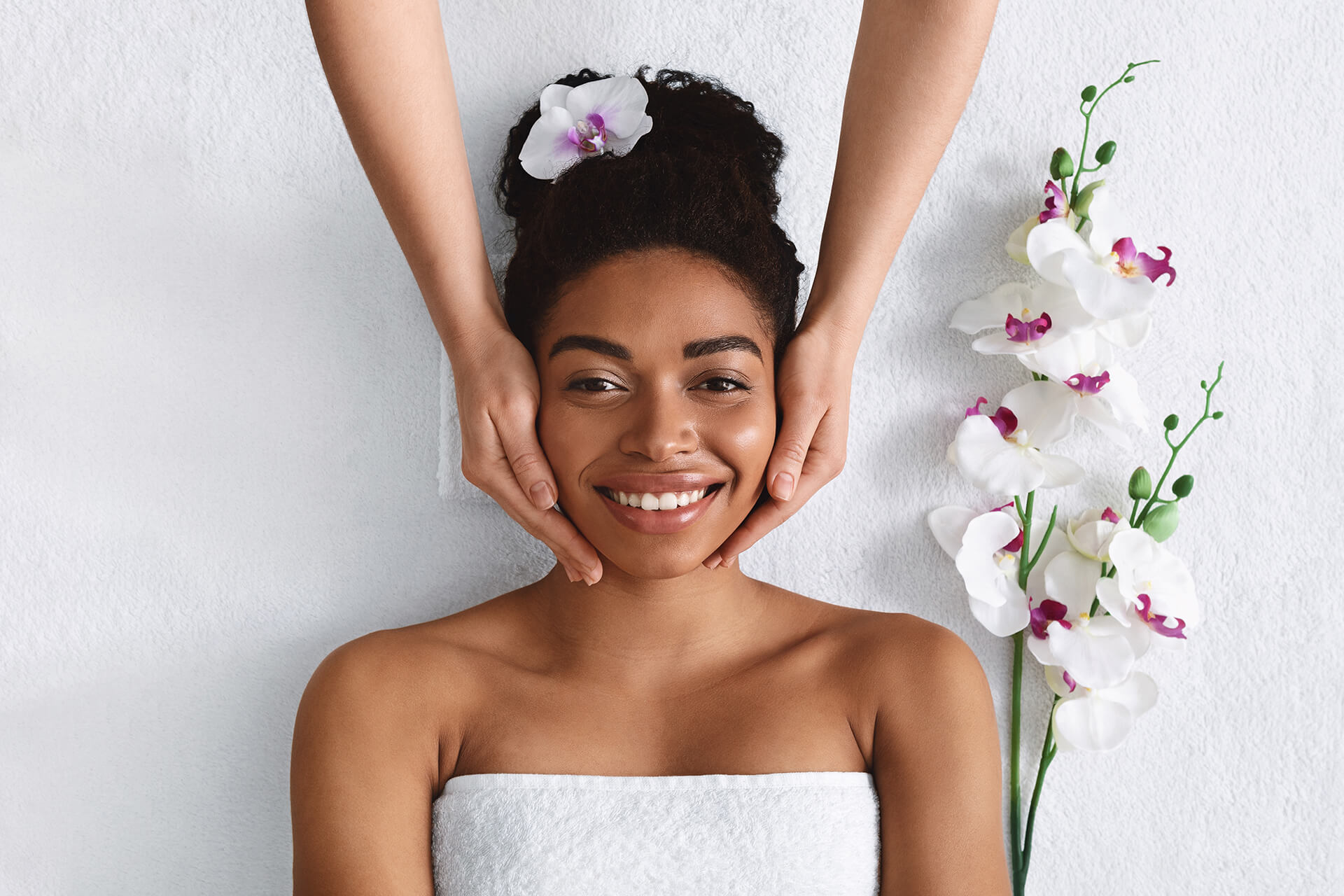 Beautician Making Face Massage For Happy Black Lady
