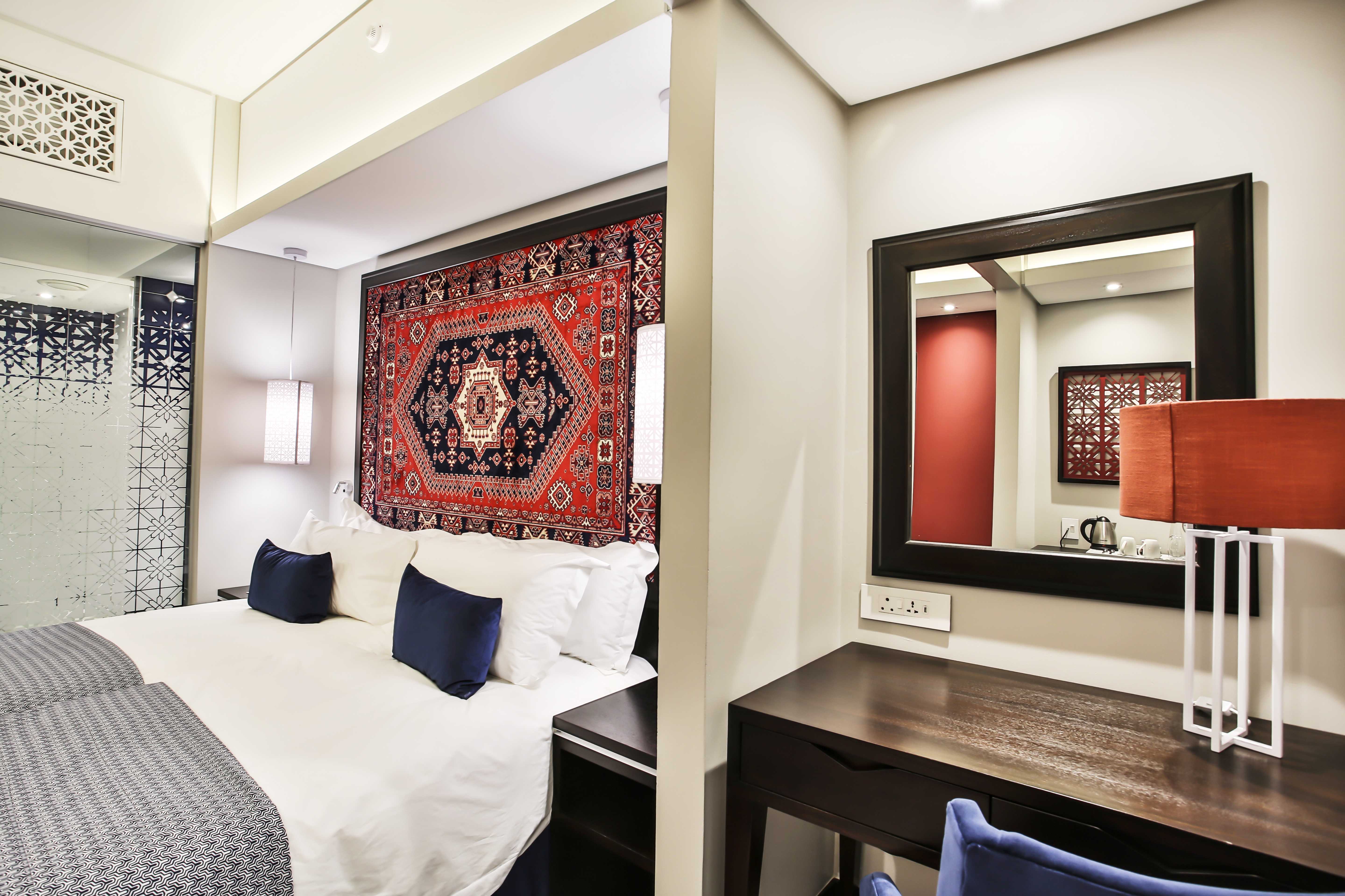 Mero Hotel Standard Twin Room Bedroom And Dresser 1