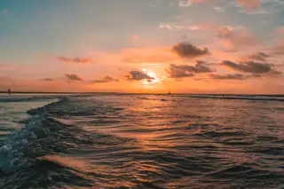 Scenic View Sea Against Cloudy Sky Sunset