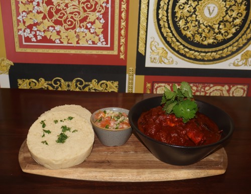 Durban-style chicken curry with steamed bread by Chef Sphelele Madondo
